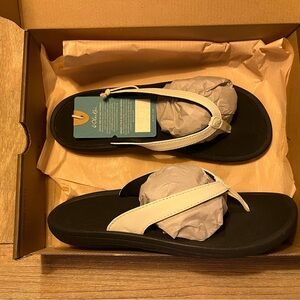 Olukai Black and White Flip Flops